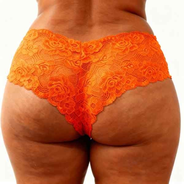 meio corpo de mulher de costas vestida em calcinha caleçon gg cor laranja