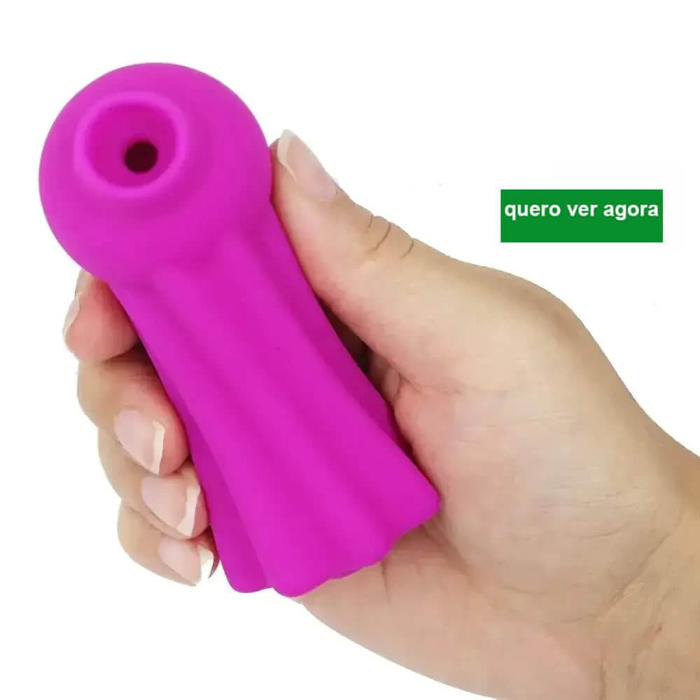 imagem de mão segurando sugador clitoriano cor pink