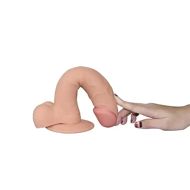 Imagem de mão flexionando pênis em cyberskin 
